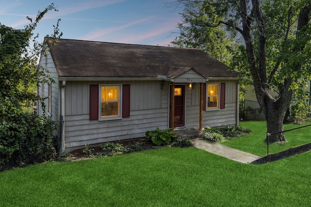 view of front of home with a yard