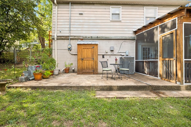 back of property featuring a patio, cooling unit, and a yard