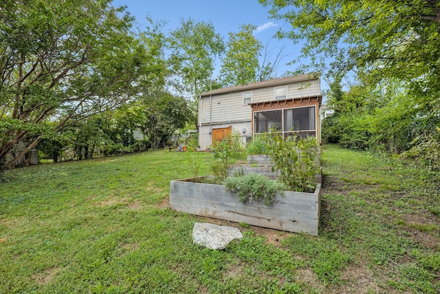 view of yard featuring a sunroom