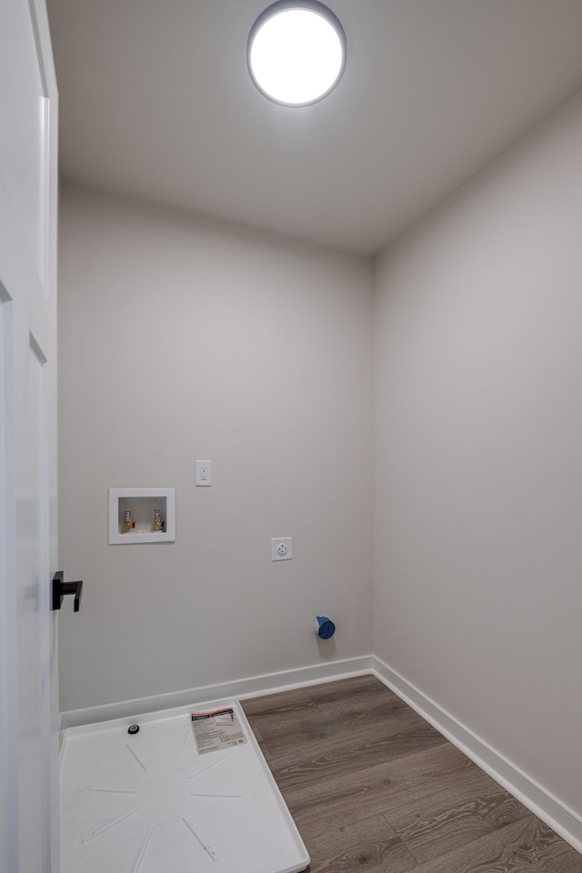 clothes washing area with electric dryer hookup, hookup for a washing machine, and dark hardwood / wood-style floors