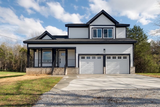 craftsman-style home with covered porch and a garage