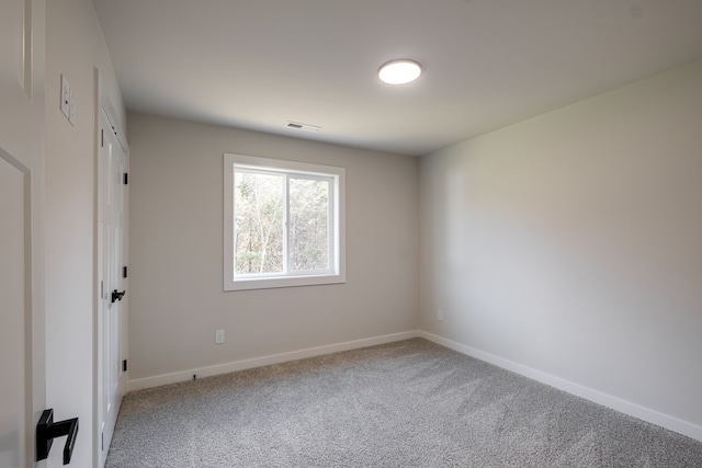 unfurnished room with carpet floors