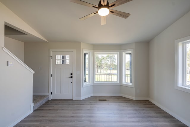 foyer entrance featuring ceiling fan, plenty of natural light, and light hardwood / wood-style floors