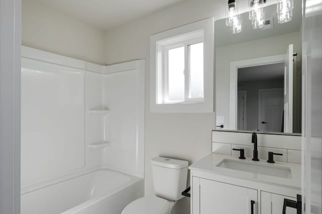 full bathroom featuring shower / tub combination, vanity, and toilet