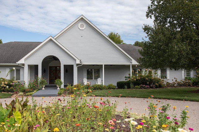 view of front of property with a front yard and a porch