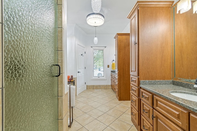 bathroom featuring a shower with shower door, tile patterned floors, and vanity