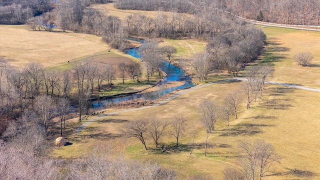 drone / aerial view with a water view and a rural view