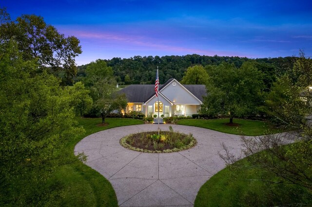 ranch-style house featuring a yard