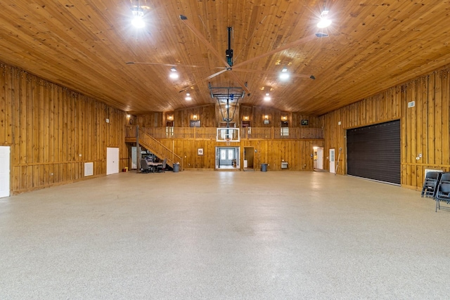 garage with wooden ceiling and wooden walls