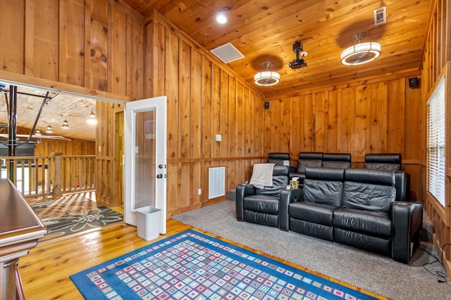 home theater with wood ceiling and hardwood / wood-style flooring