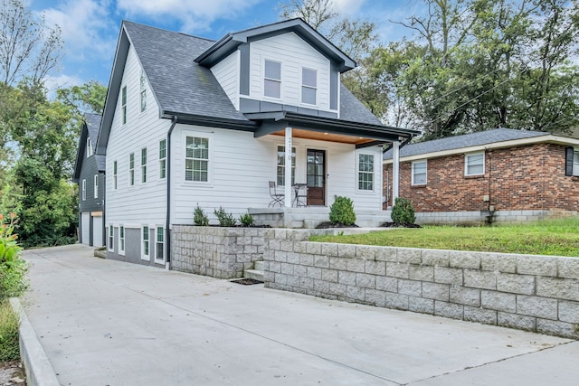 view of front of home featuring a garage and covered porch