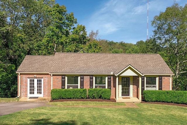 ranch-style house with a front yard