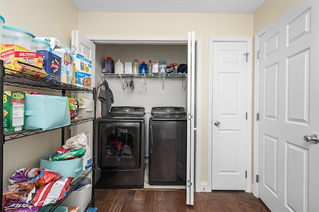 laundry room featuring washing machine and dryer and dark hardwood / wood-style floors