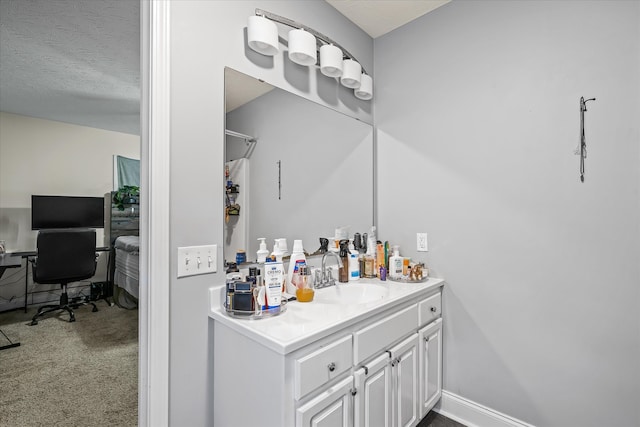 bar with sink, white cabinets, carpet flooring, and a textured ceiling