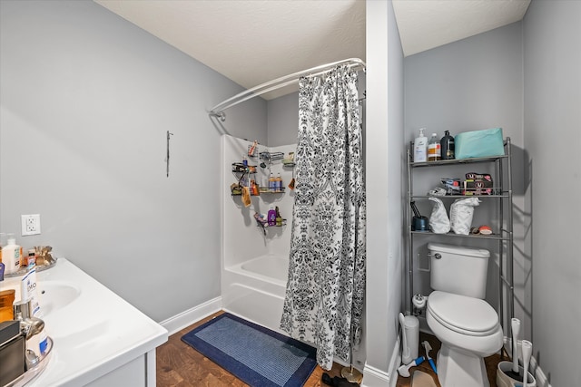 full bathroom featuring a textured ceiling, shower / bath combo, toilet, vanity, and hardwood / wood-style flooring