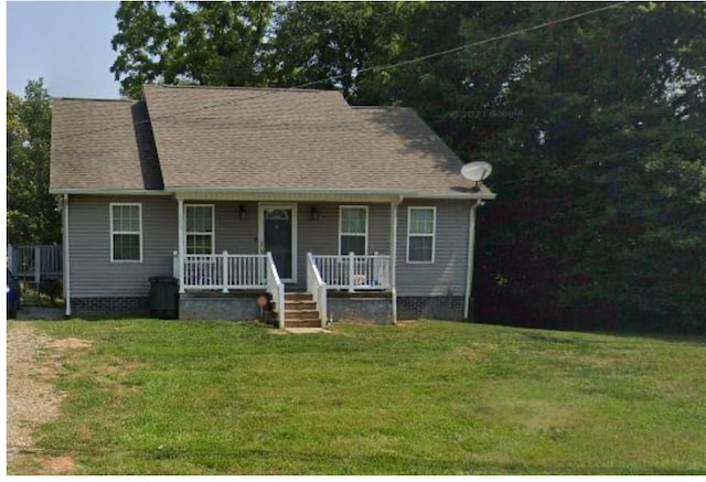 view of front facade with a front yard and a porch