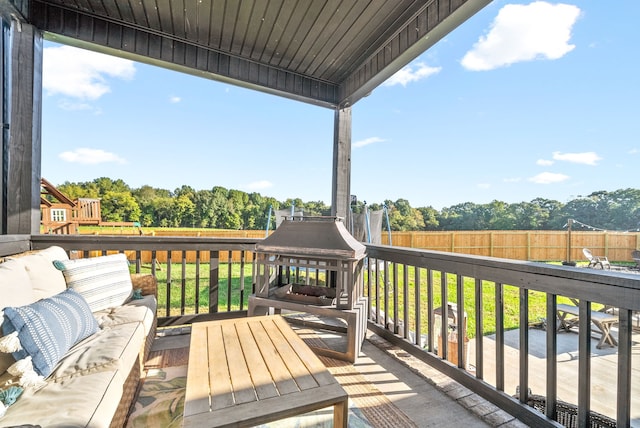 deck with a yard and a patio area