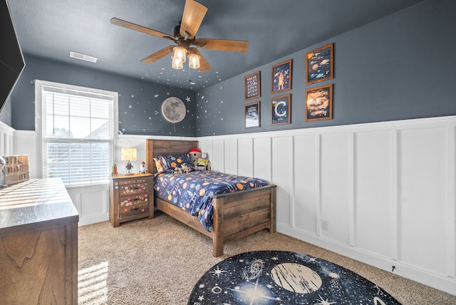 carpeted bedroom with ceiling fan