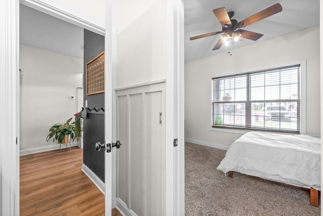 bedroom featuring ceiling fan and wood-type flooring