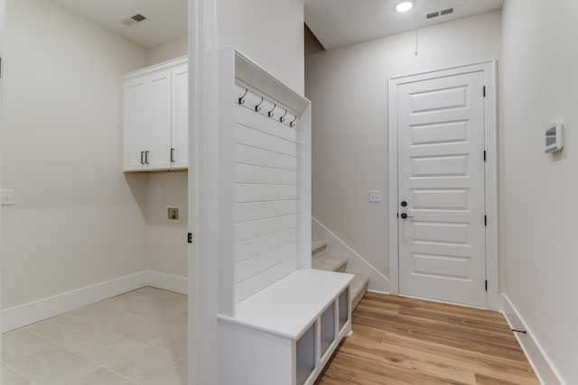 mudroom with light hardwood / wood-style flooring