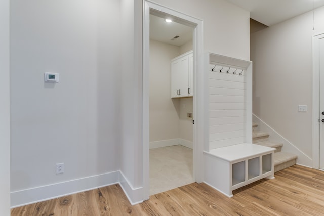 mudroom with light hardwood / wood-style flooring