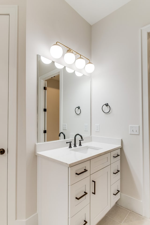 bathroom with tile patterned flooring and vanity