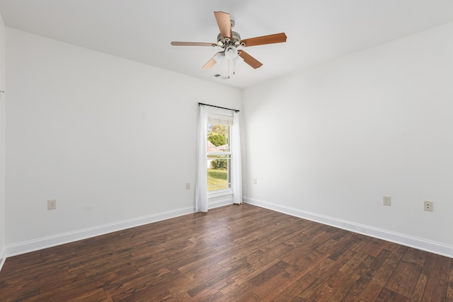 spare room featuring dark hardwood / wood-style floors and ceiling fan