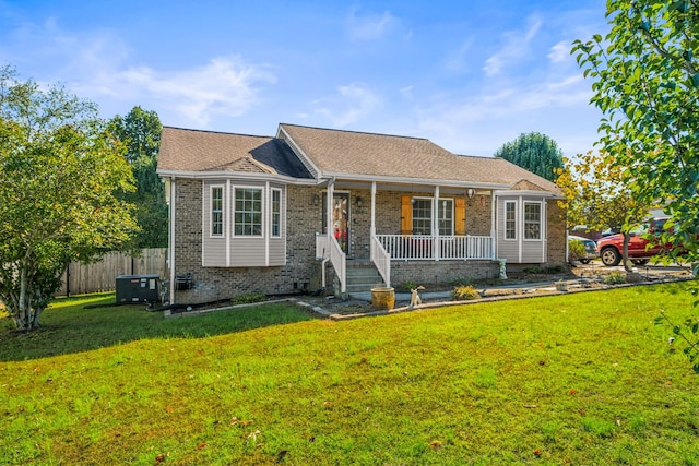 single story home with a front yard and a porch