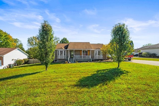 single story home featuring a front lawn and covered porch