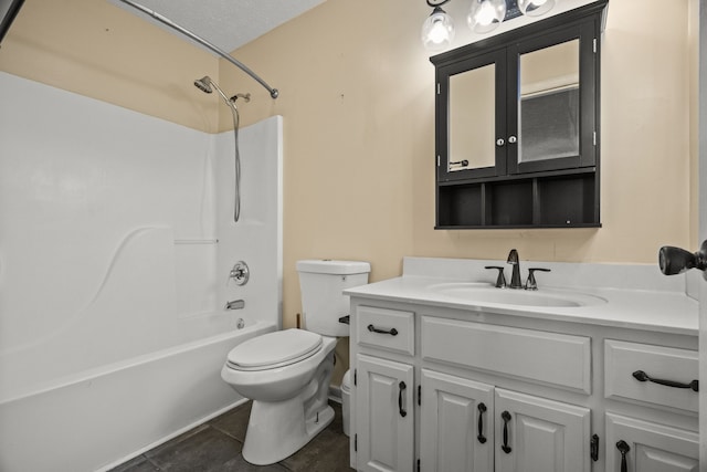 full bathroom featuring washtub / shower combination, a textured ceiling, toilet, vanity, and tile patterned flooring