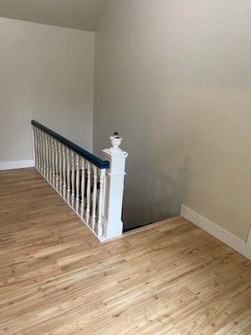 stairs with wood-type flooring