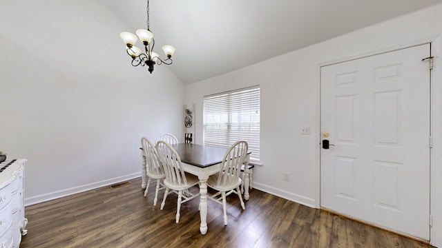 dining room with vaulted ceiling, dark wood-type flooring, and a notable chandelier