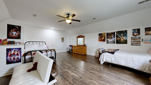 bedroom with lofted ceiling, ceiling fan, and dark wood-type flooring