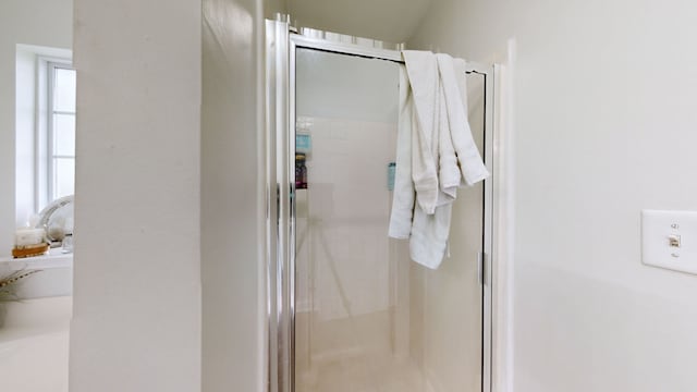 bathroom featuring an enclosed shower