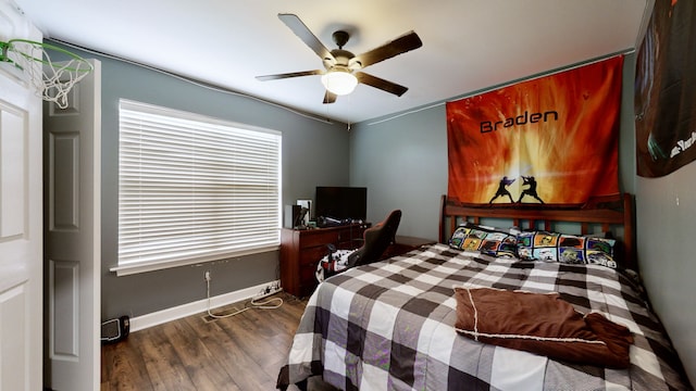 bedroom featuring dark hardwood / wood-style floors and ceiling fan