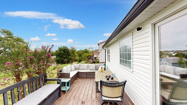 wooden terrace with outdoor lounge area