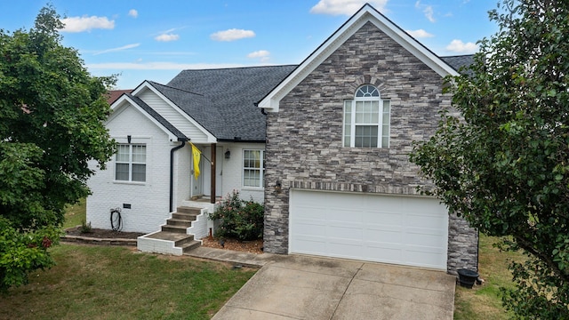 view of front of property with a front yard and a garage