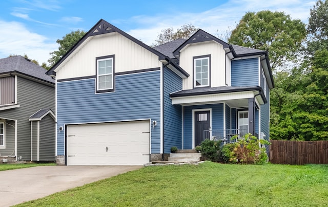 front facade featuring a front lawn, covered porch, and a garage