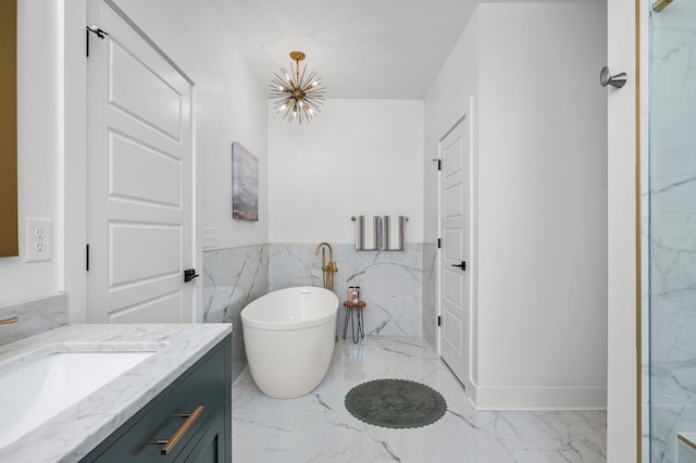 bathroom featuring vanity and a tub