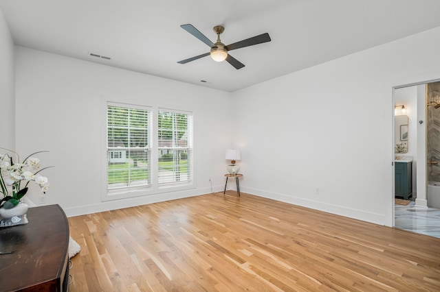 interior space with light hardwood / wood-style floors and ceiling fan