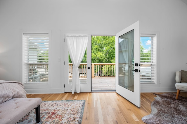 doorway to outside with light hardwood / wood-style flooring and french doors