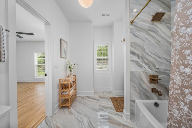 bathroom featuring wood-type flooring, separate shower and tub, plenty of natural light, and ceiling fan