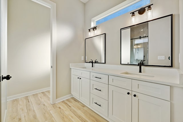 bathroom featuring vanity and hardwood / wood-style flooring