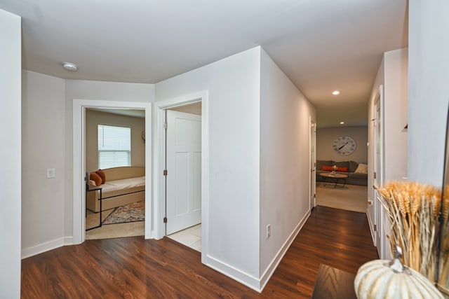 hall with dark hardwood / wood-style floors