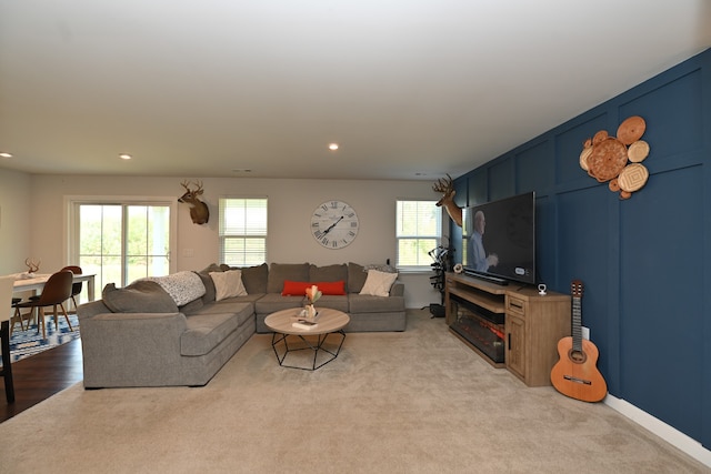 carpeted living room featuring a wealth of natural light