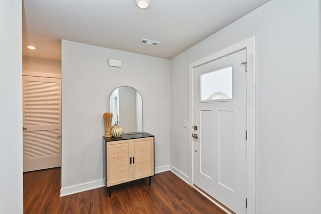 foyer entrance featuring dark hardwood / wood-style floors