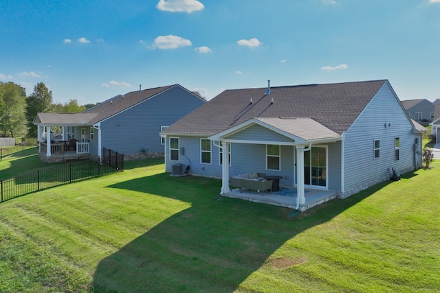 back of house featuring cooling unit, a yard, and a patio area