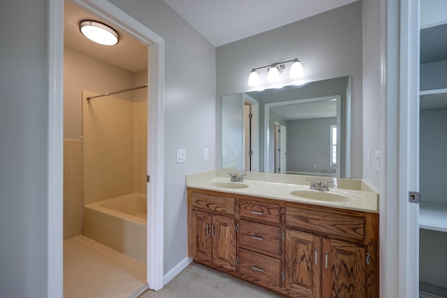 bathroom featuring tile patterned flooring and vanity