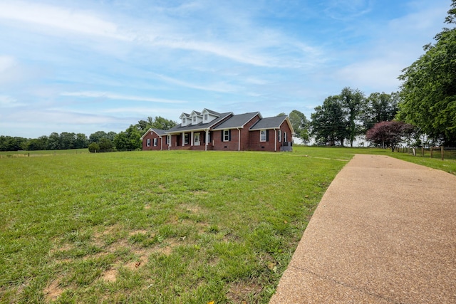 ranch-style home featuring a front yard