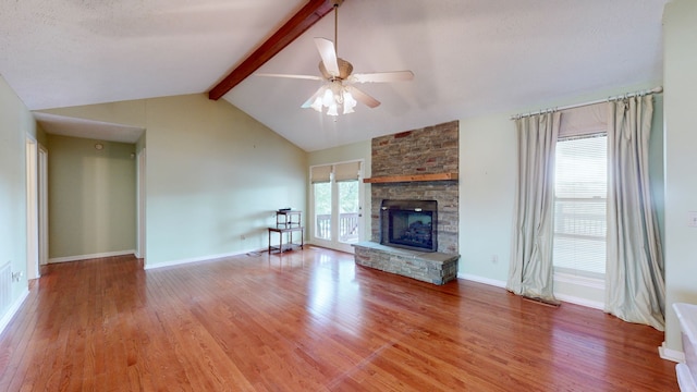 unfurnished living room featuring hardwood / wood-style flooring, a fireplace, and plenty of natural light